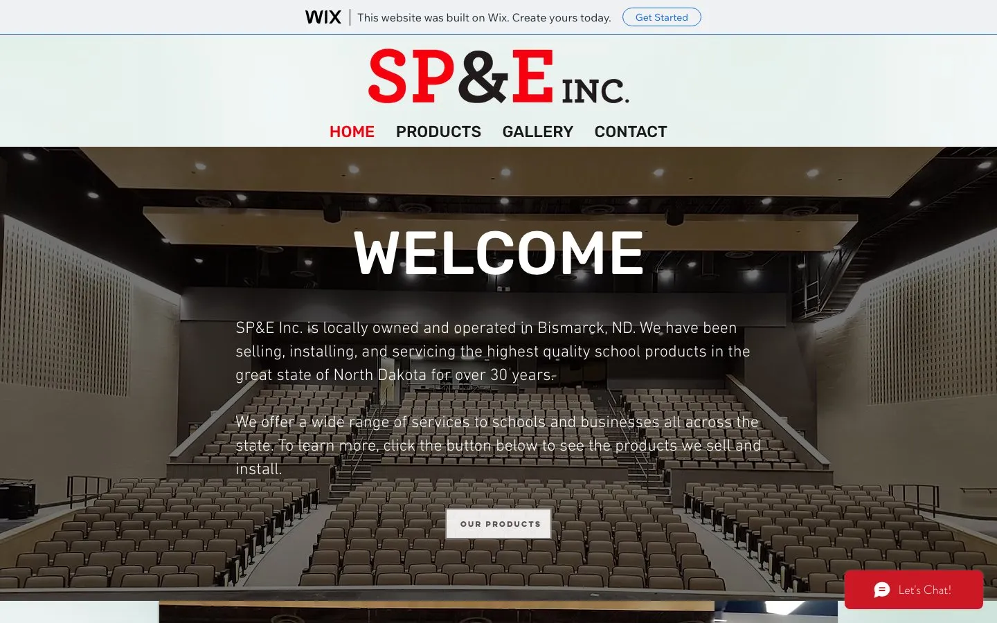 SP&E's old Wix website: a Wix ad bar across the top, a WELCOME banner over an auditorium photo, and a chat bubble.